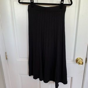 Asymmetric long black knit skirt